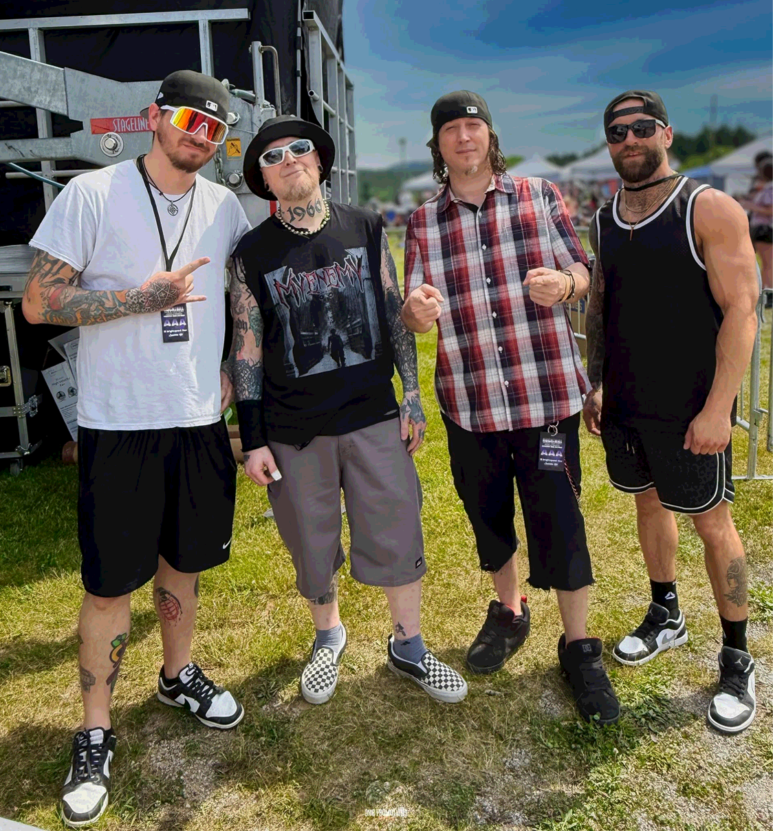 The guys at a festival standing for a photo. Photo Credit: OMG Promotions