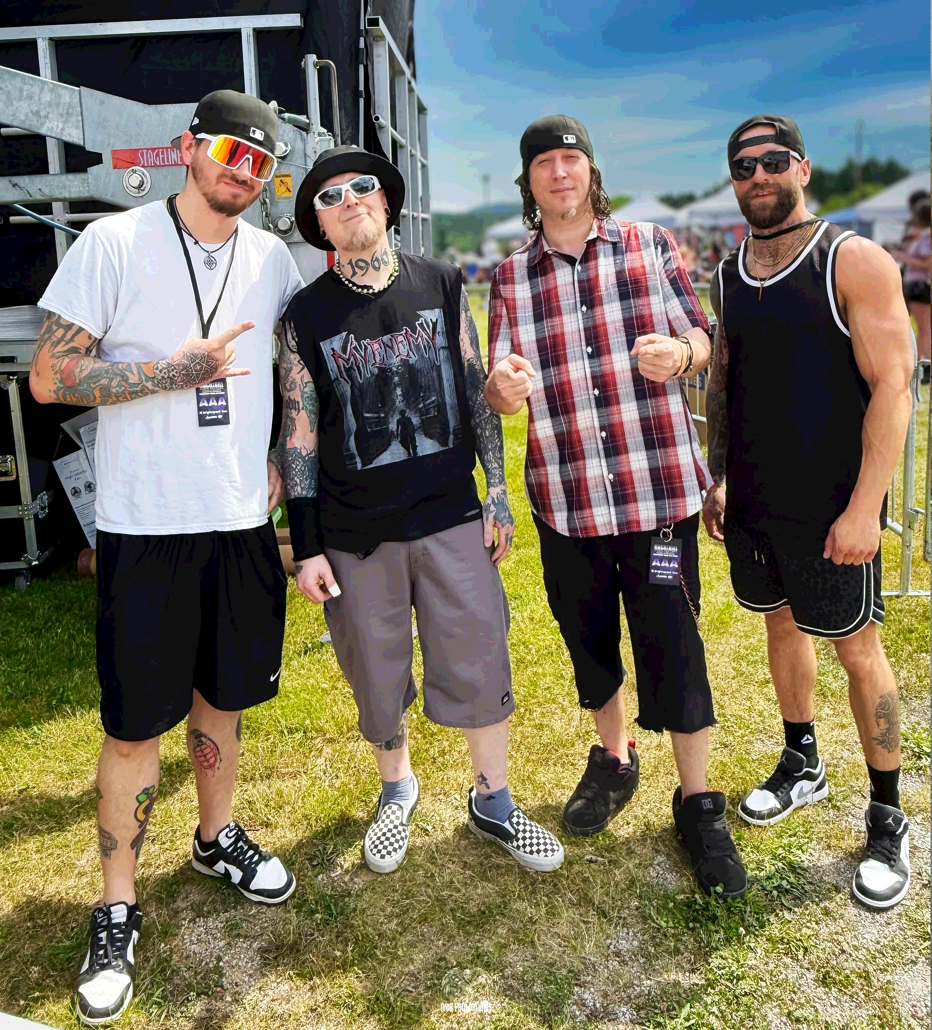 The guys at a festival standing for a photo. Photo Credit: OMG Promotions